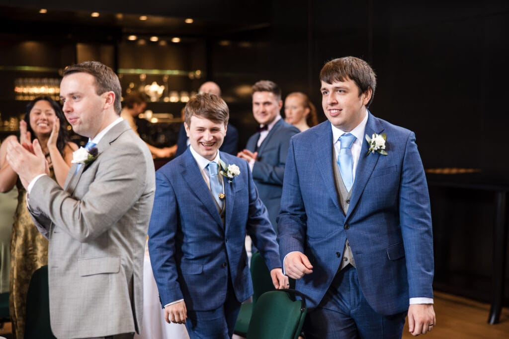 The Grooms enter the room for the wedding breakfast.