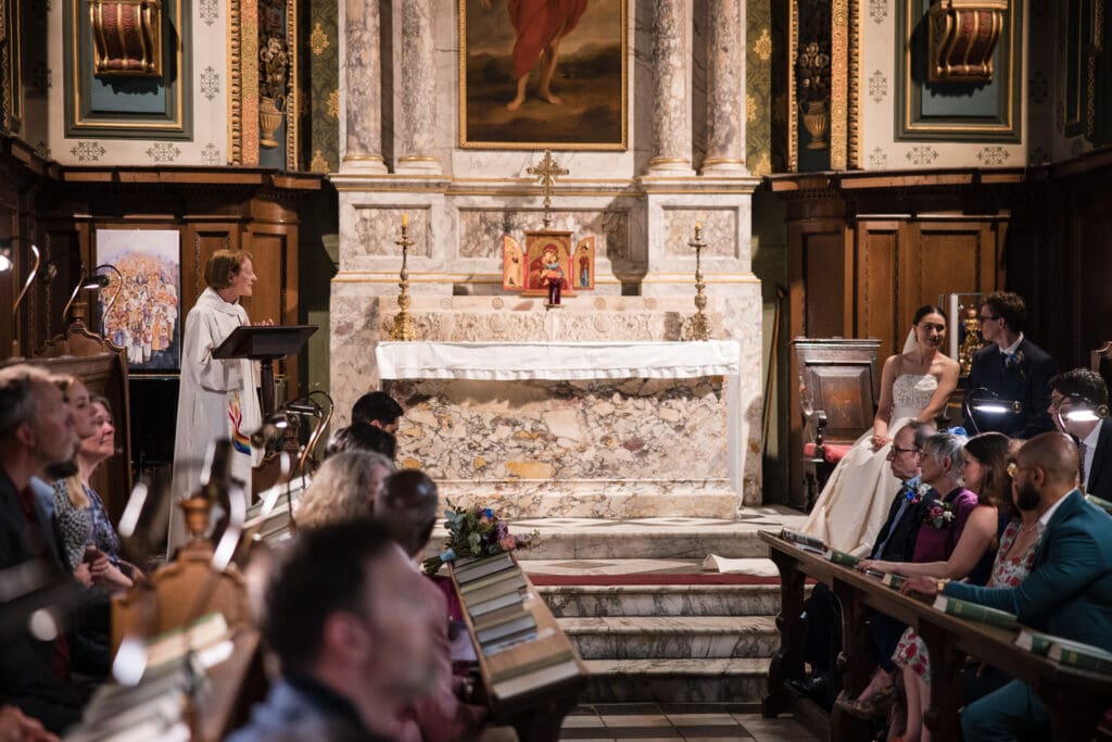 Bride and Groom seated inside the Damon Wells Chapel at Pembroke College.