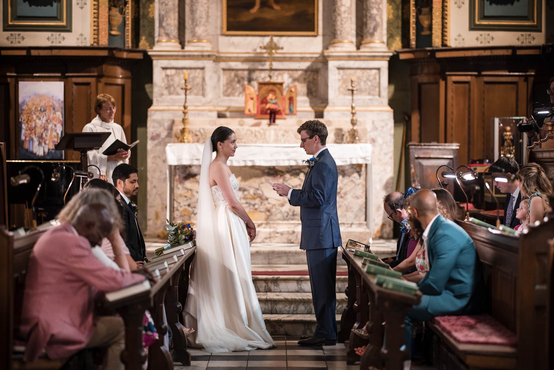 Groom reading to the Bride in the Damon Wells Chapel at Pembroke College Oxford