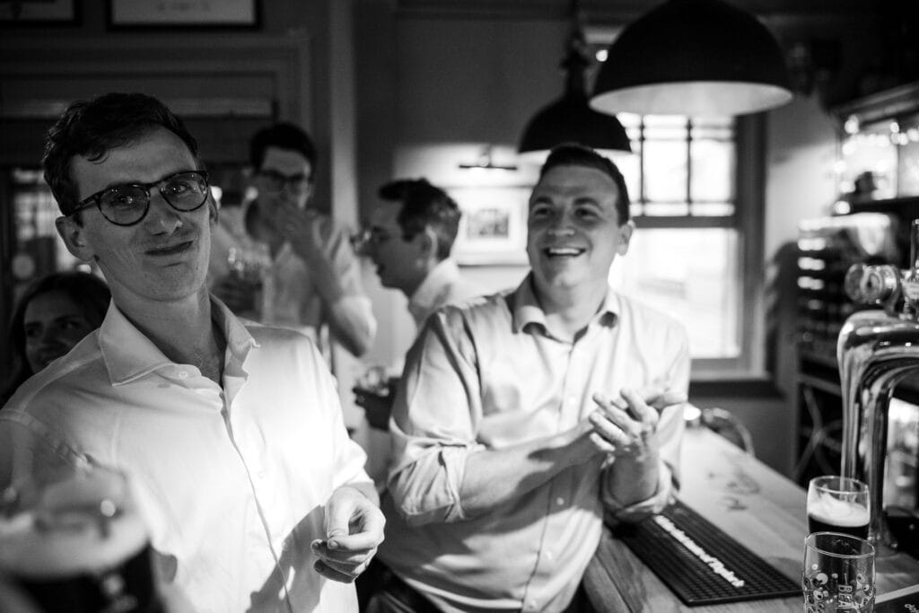The groom tasting the effects of his shot at the St Aldates Tavern in Oxford