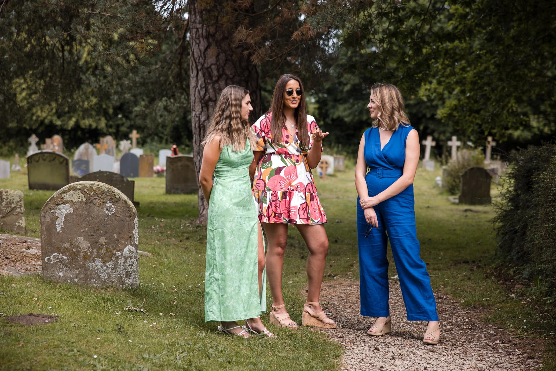 Three woman talking in the Churchyard