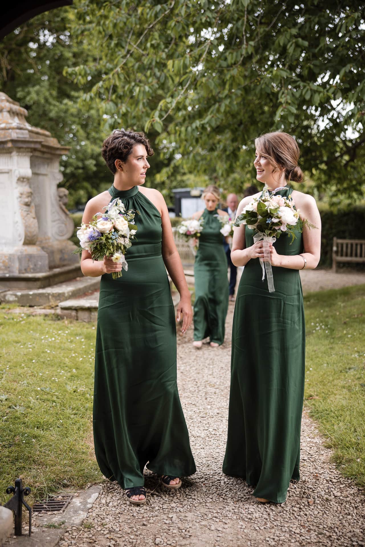 Two bridesmaids looking at each other