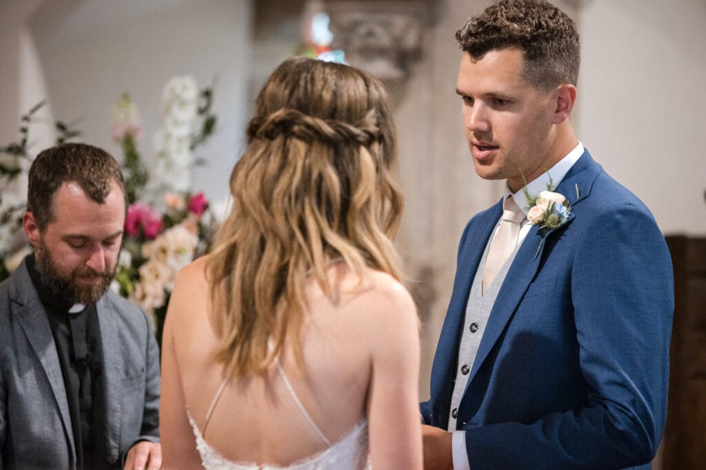 Bride and Groom being married at Cotswold Sandhurst Wedding