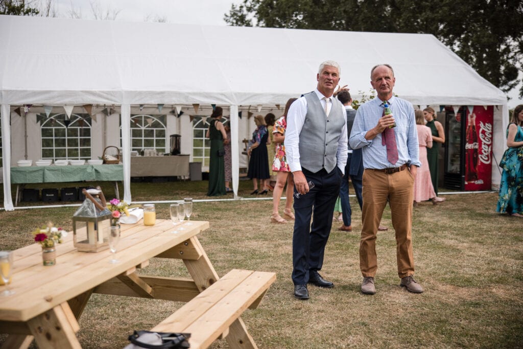 Father of the Groom and Friend talking over a beer