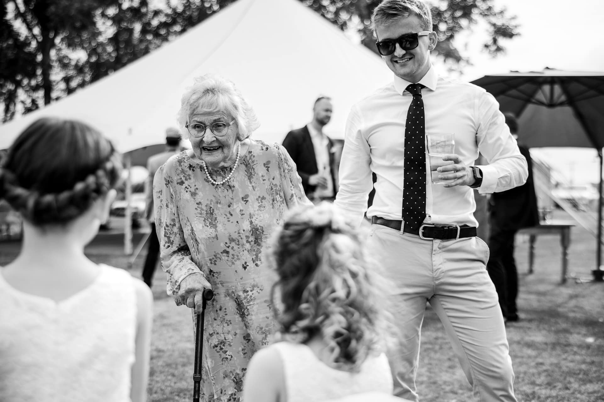 Old lady listening to young girls at the Sandhurst Farm Wedding Reception