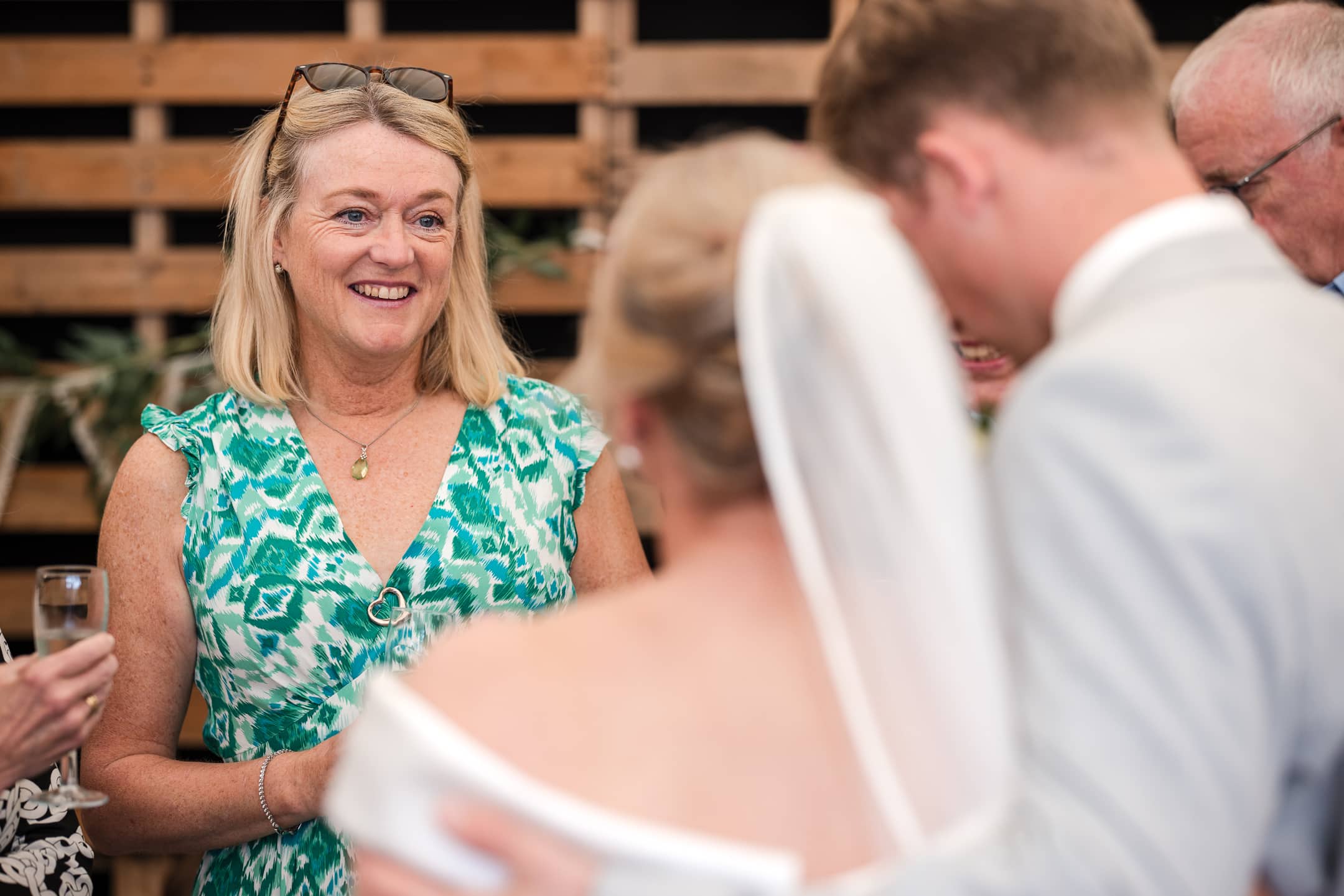 Wedding Guests talking to the bride at Dovecote Barn