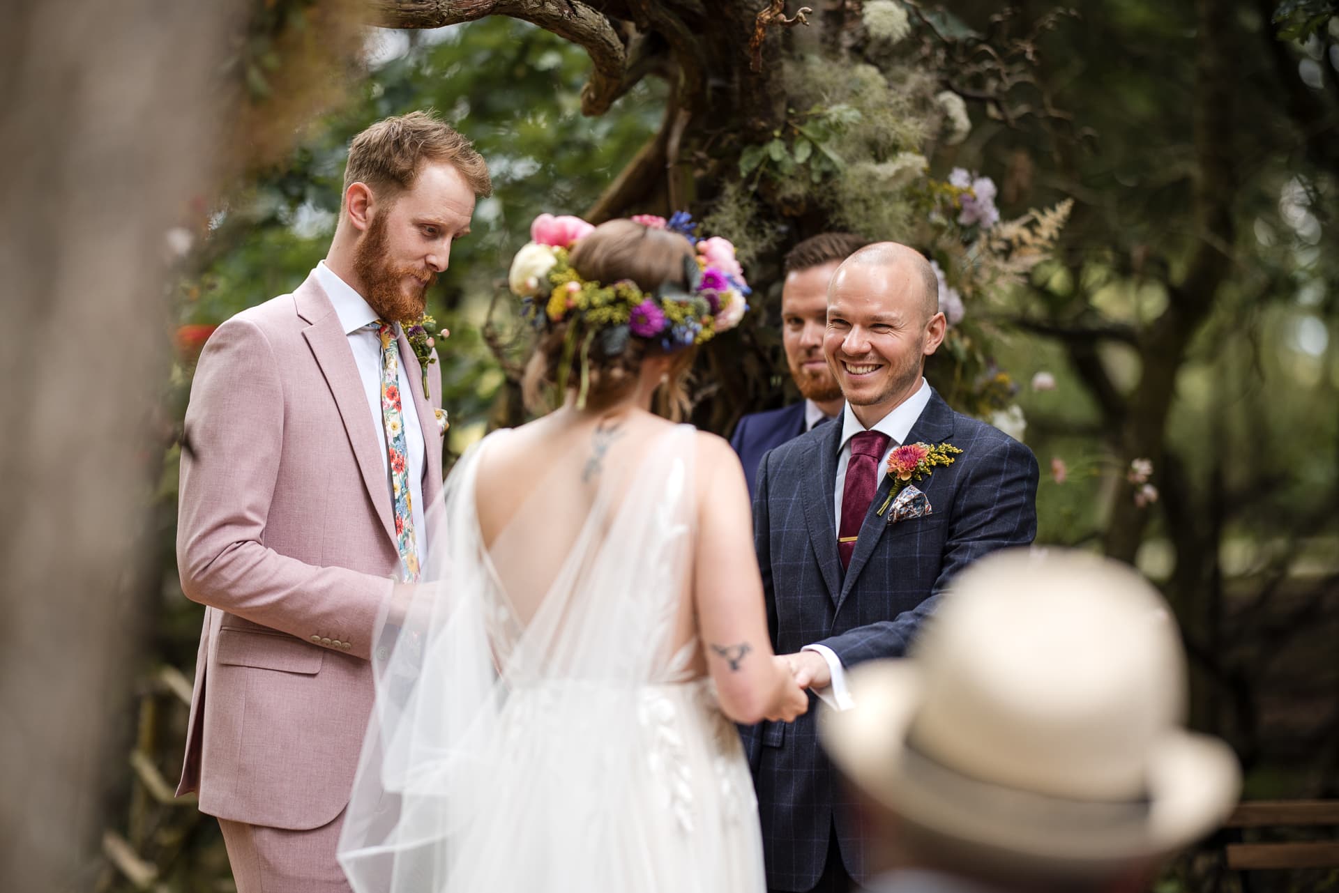 Groom smiling to his bride during outdoor wedding at the Endeavour Woodland wedding venue