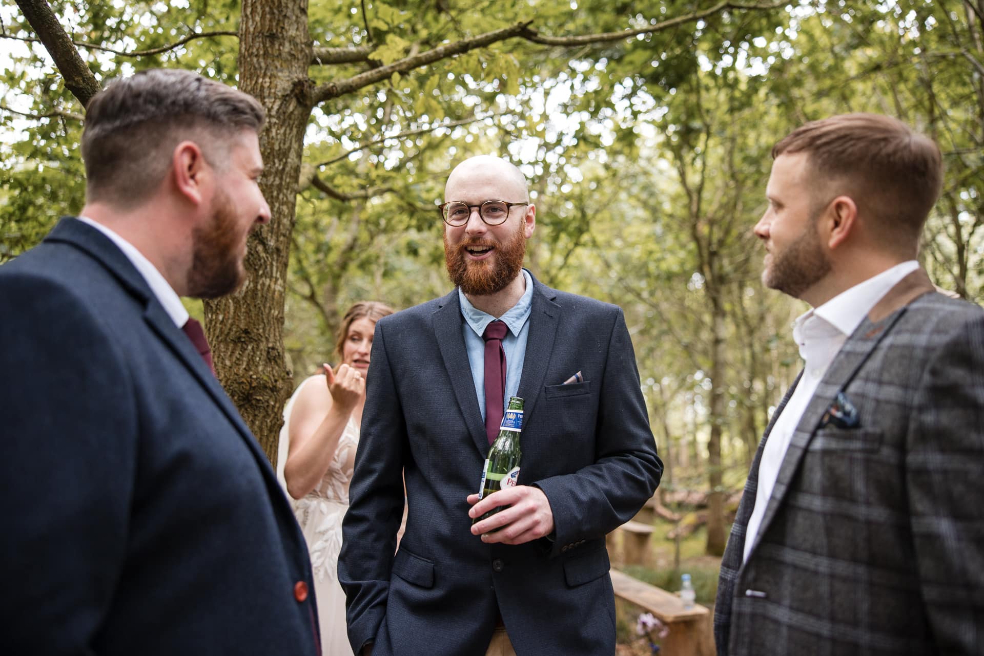 Guests chatting in the woodland at the Endeavour Woodland wedding venue