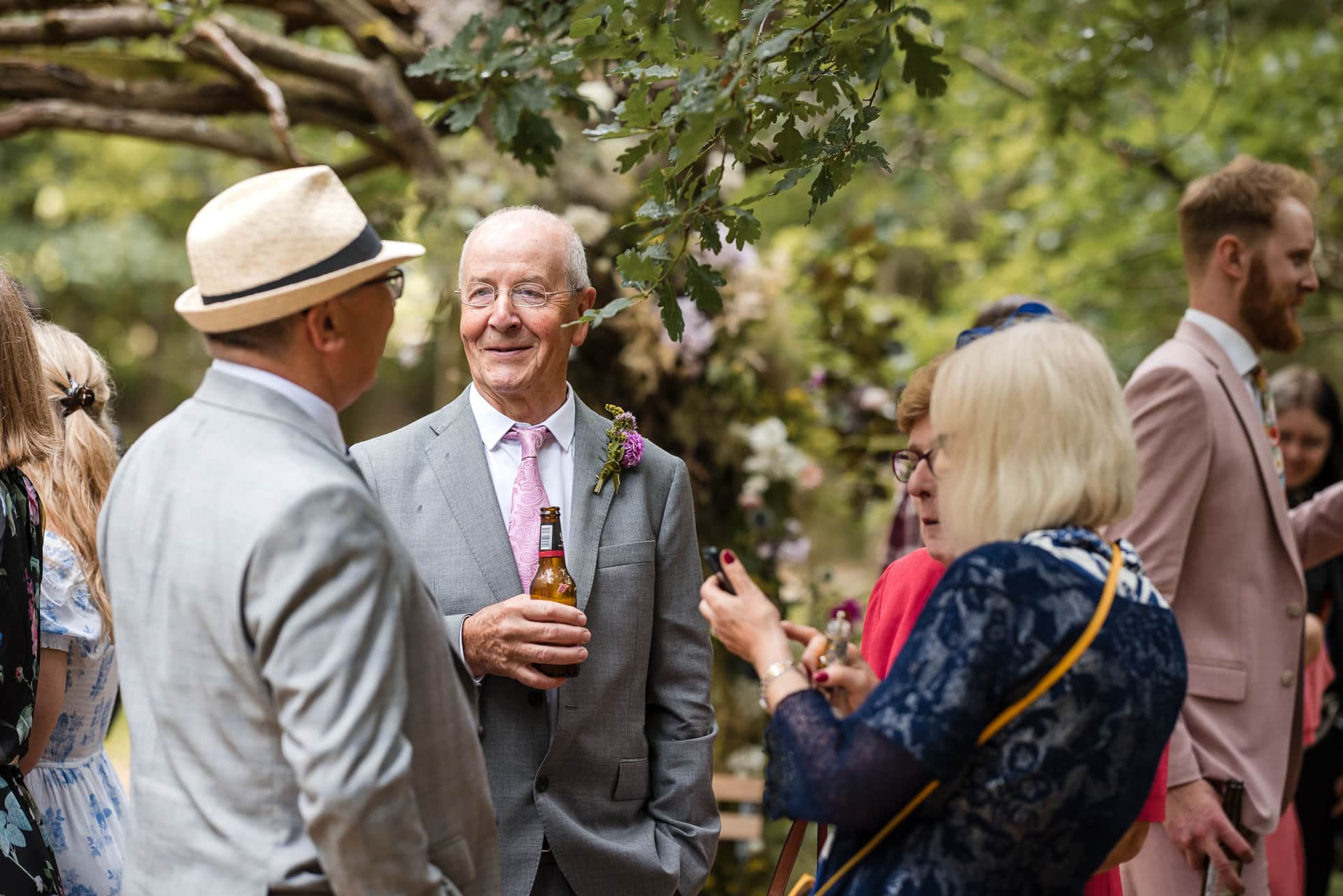 Talking under and oak tree at the Endeavour Woodland wedding venue