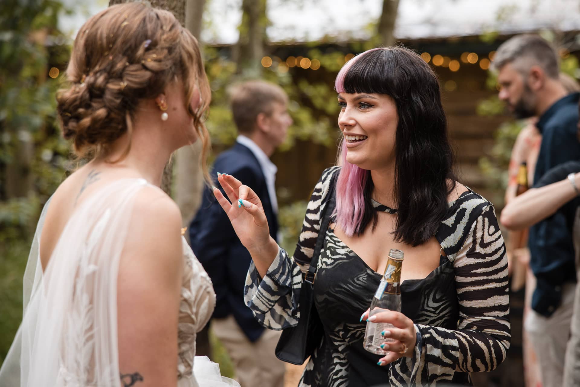 Bride talking to friend at the Endeavour Woodland wedding venue
