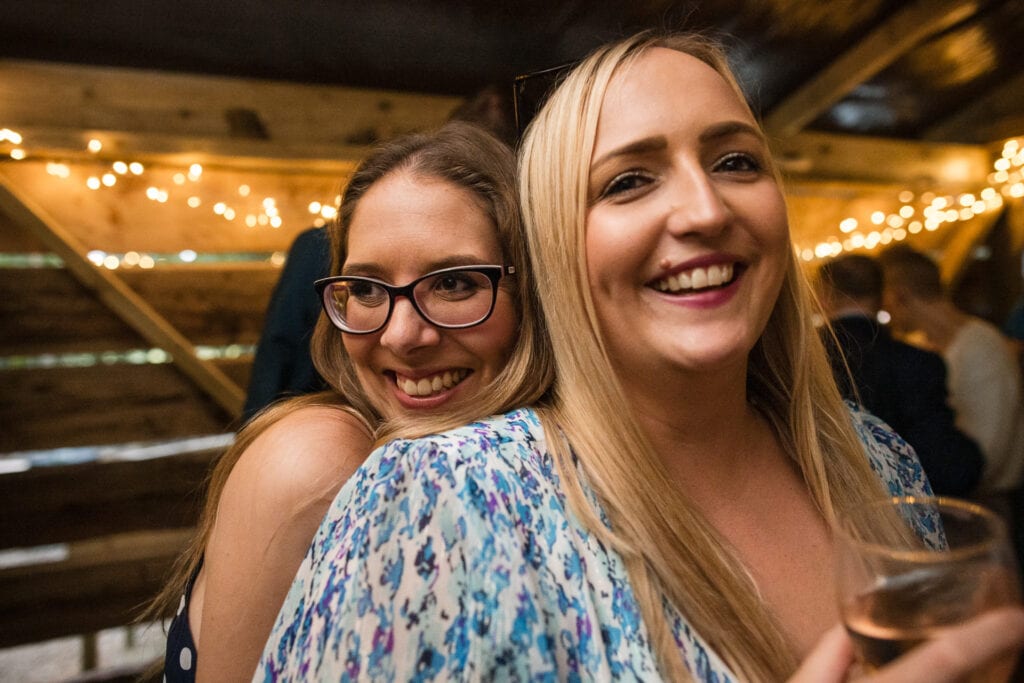 Friends dancing at Endeavour Woodland wedding