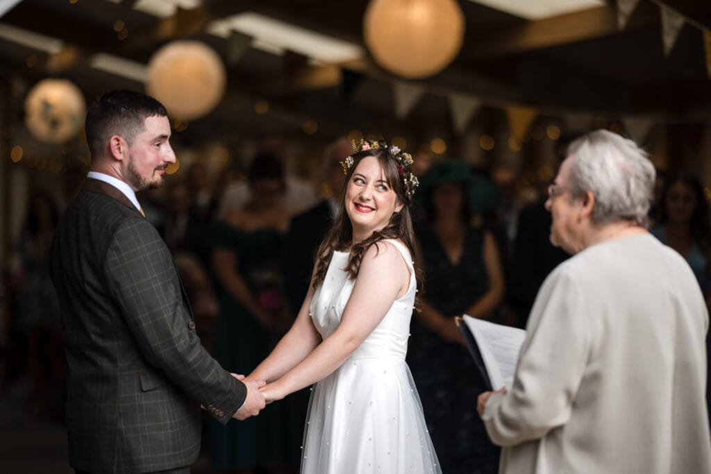 Bride and Groom being married at the Acorn Barn Wedding Venue
