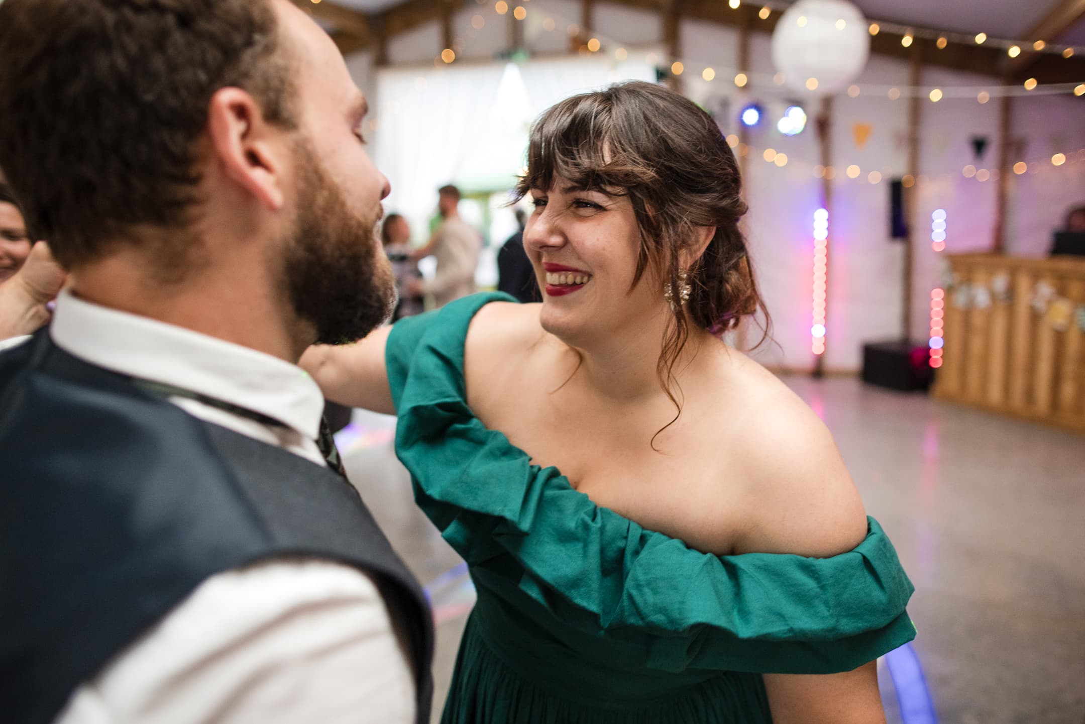 Bridesmaid dancing with Groomsman at the Acorn Barn Wedding Venue