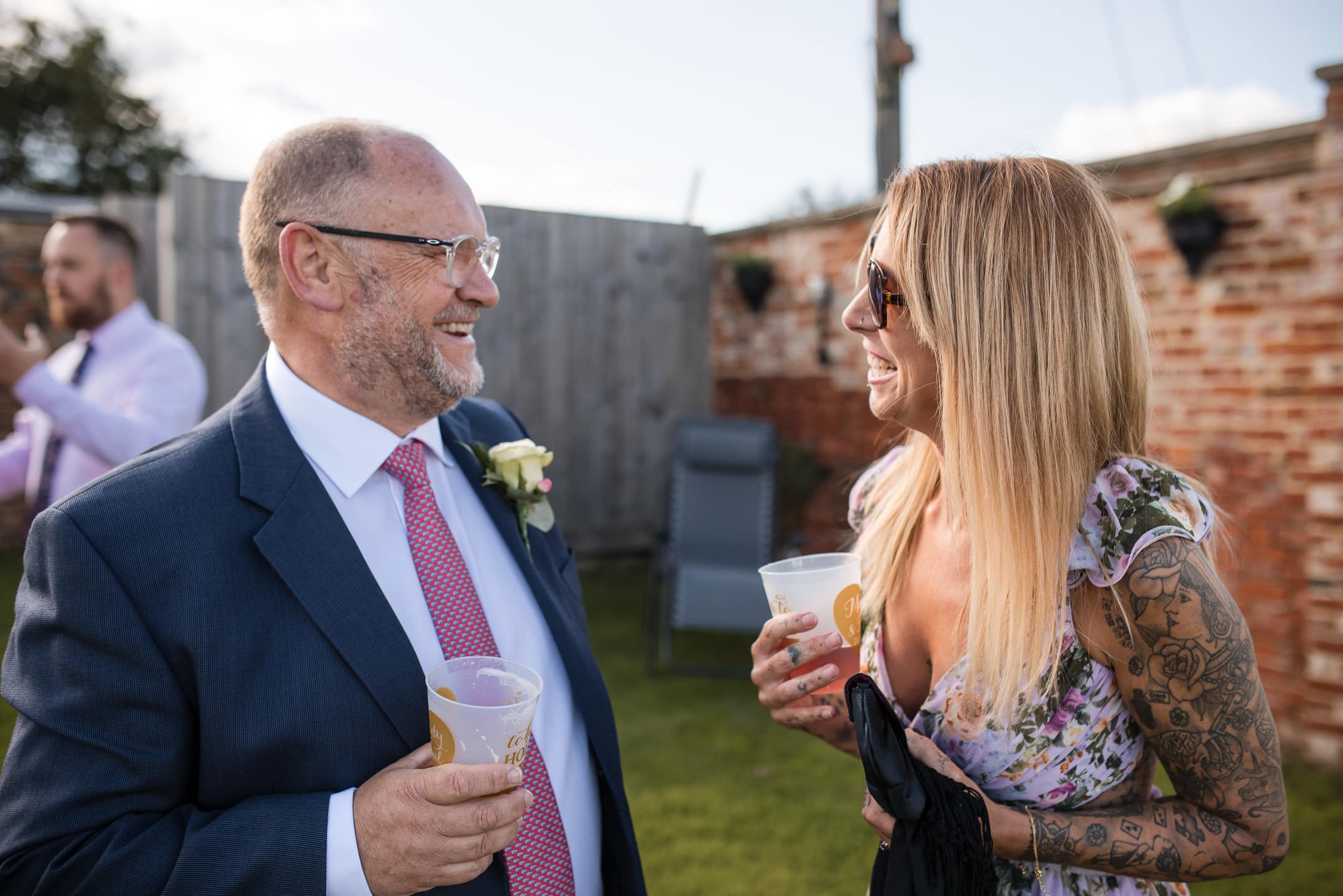 Guests having a laugh at the Dovecote Barn Wedding