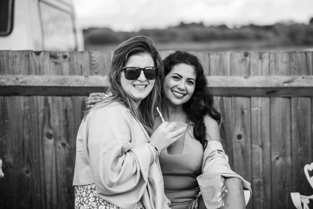 Friends smiling for the camera at the Dovecote Barn Wedding