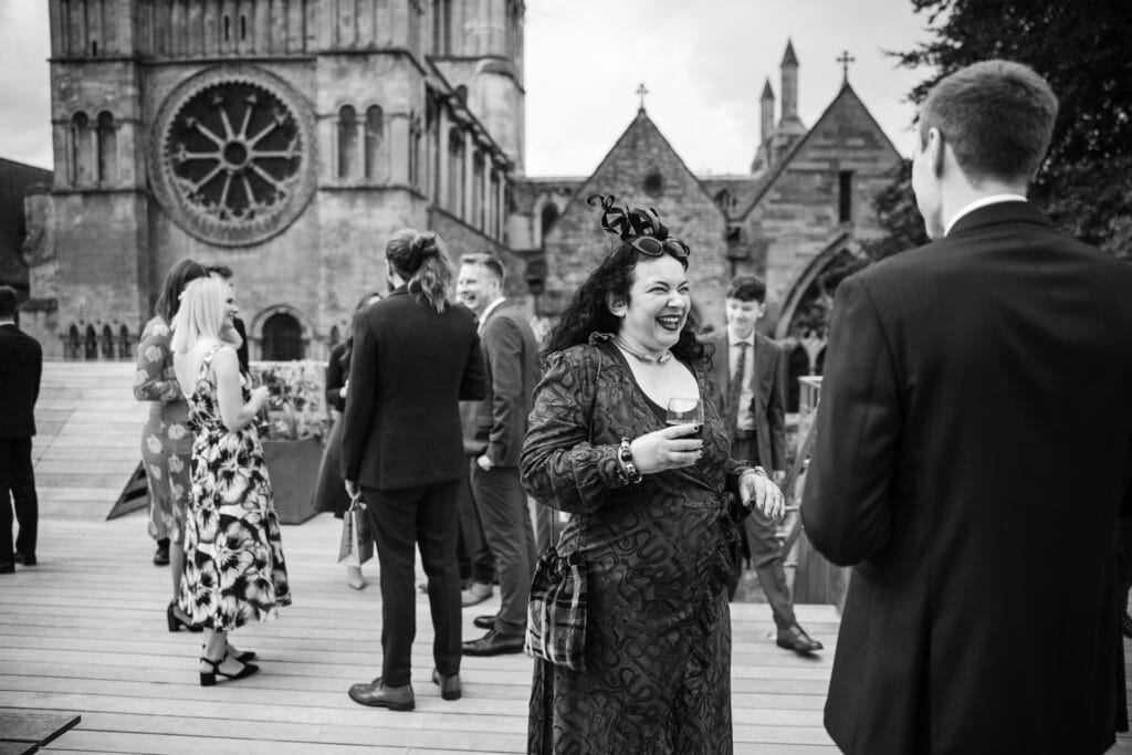 Guests talking on the terrace with Christchurch in the background
