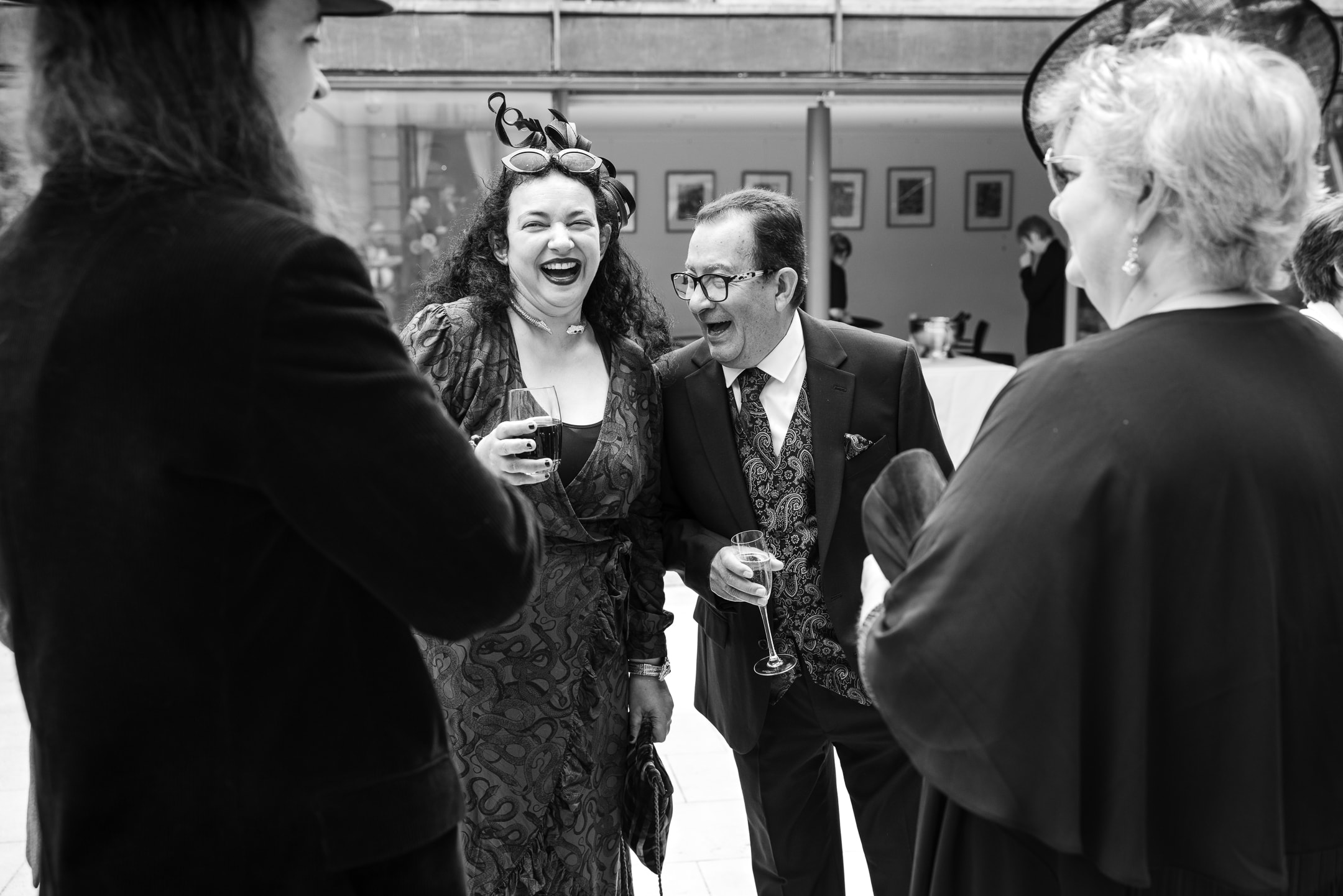 Father of the Bride laughing during drinks reception