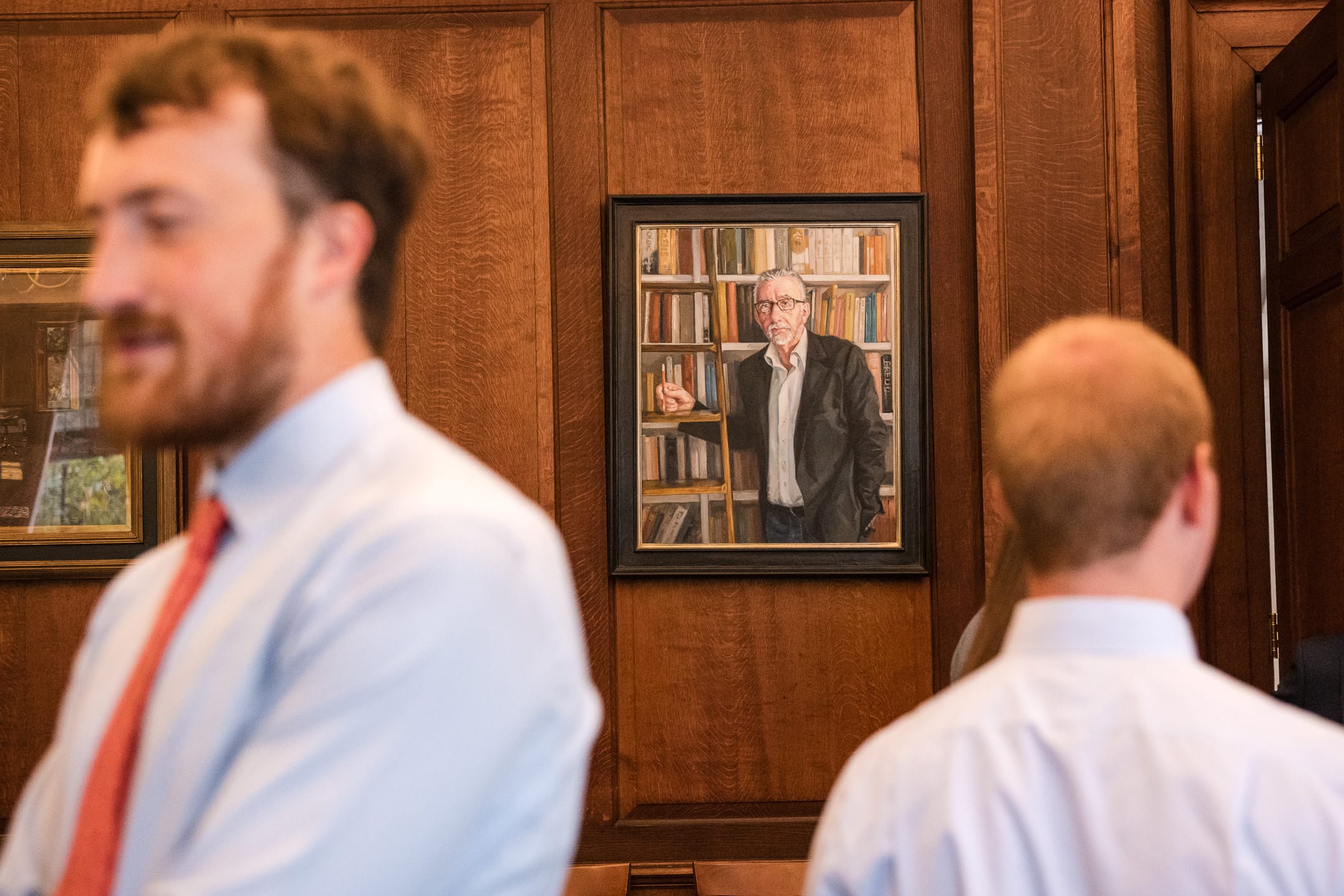 Wall Portrait looking on at guests during drinks reception at Corpus Christi College Oxford Wedding