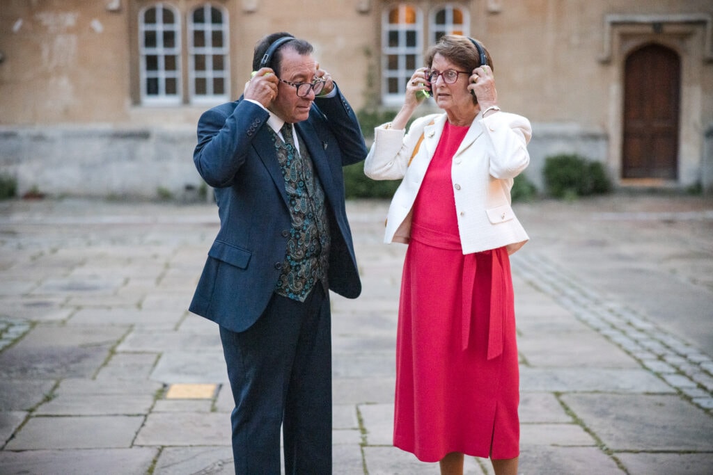 Old couple experiencing a Silent Disco for the first time