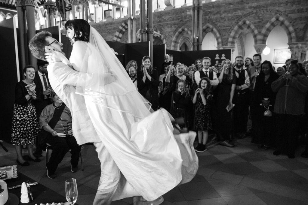 The Lift after cutting the cake at the Oxford Natural History Museum wedding reception