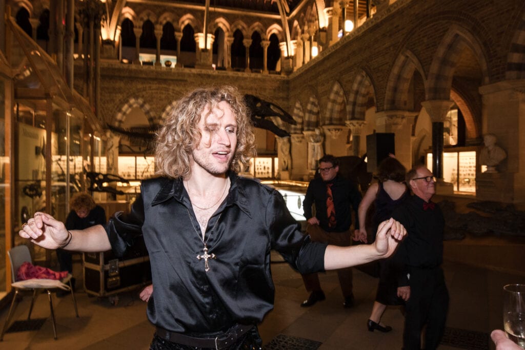 Guest dancing at the Oxford Natural History Museum wedding reception