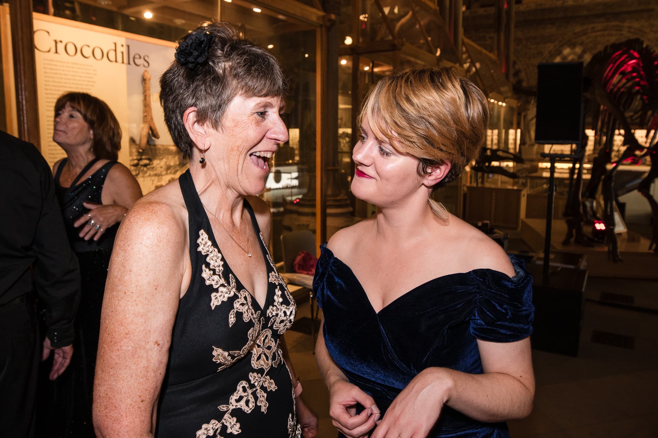 Two Guests chatting whilst dancing at the Oxford Natural History Museum wedding reception