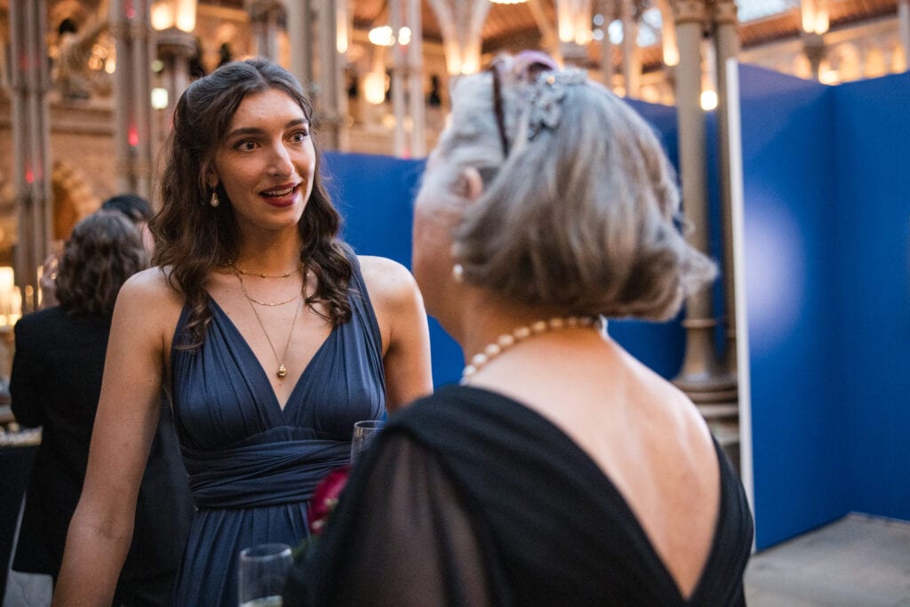 Guests looking at each other at the Oxford Natural History Museum Wedding