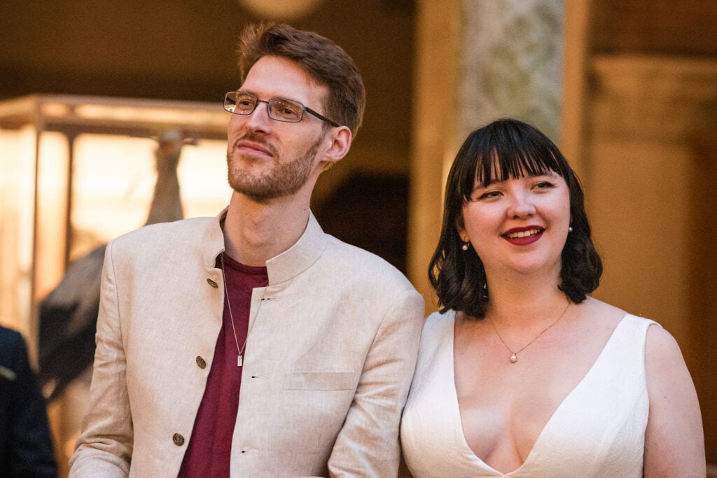 Bride and Groom looking on at the Oxford Natural History Museum