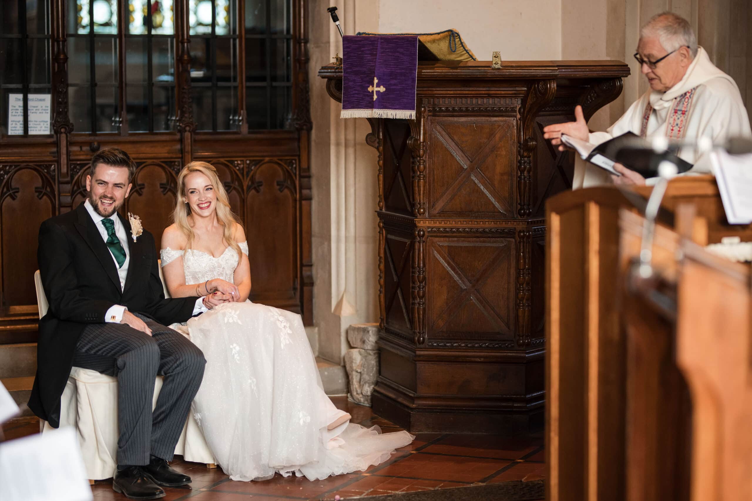 Vicar talking to couple getting married