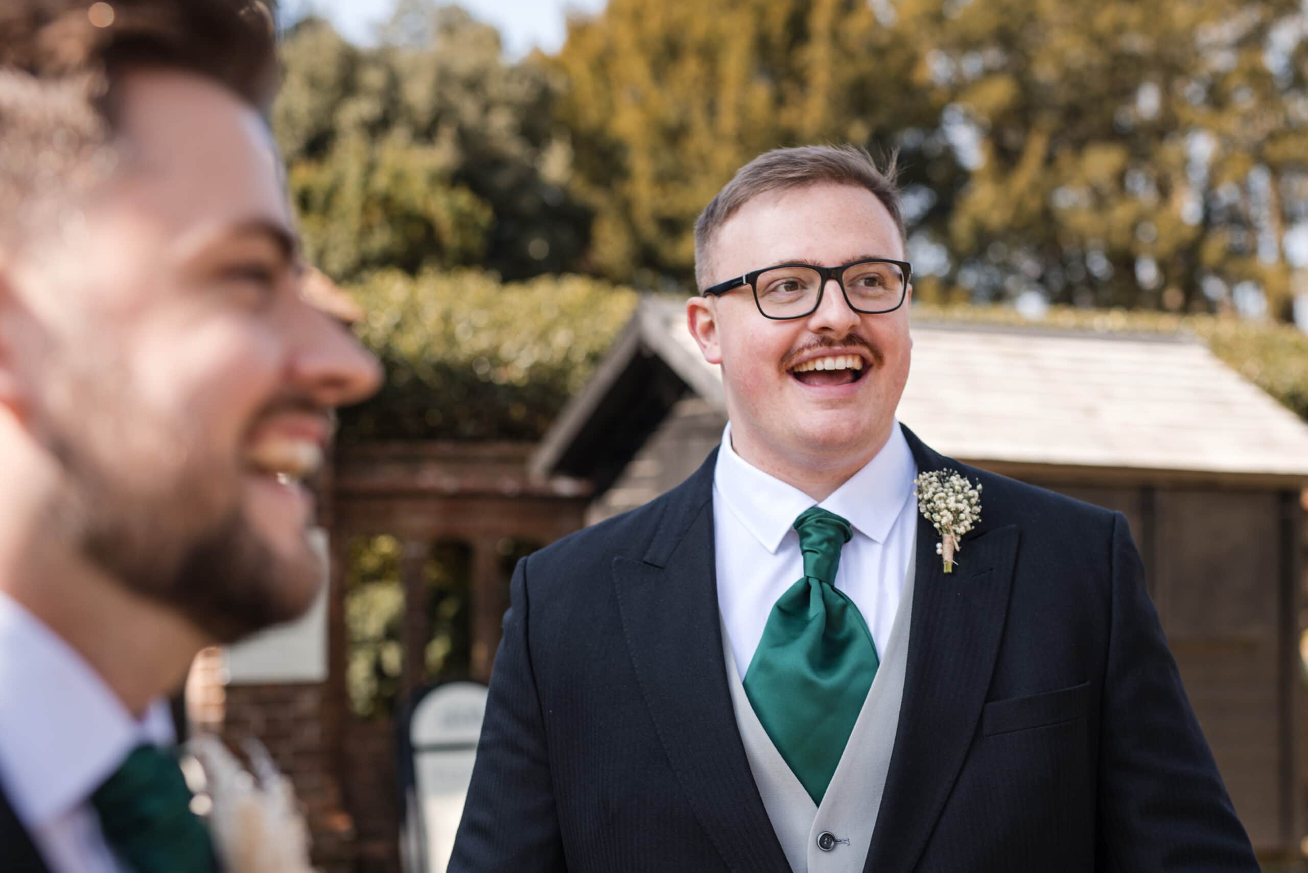 Groom and Groomsmen having a laugh at Chenies Manor