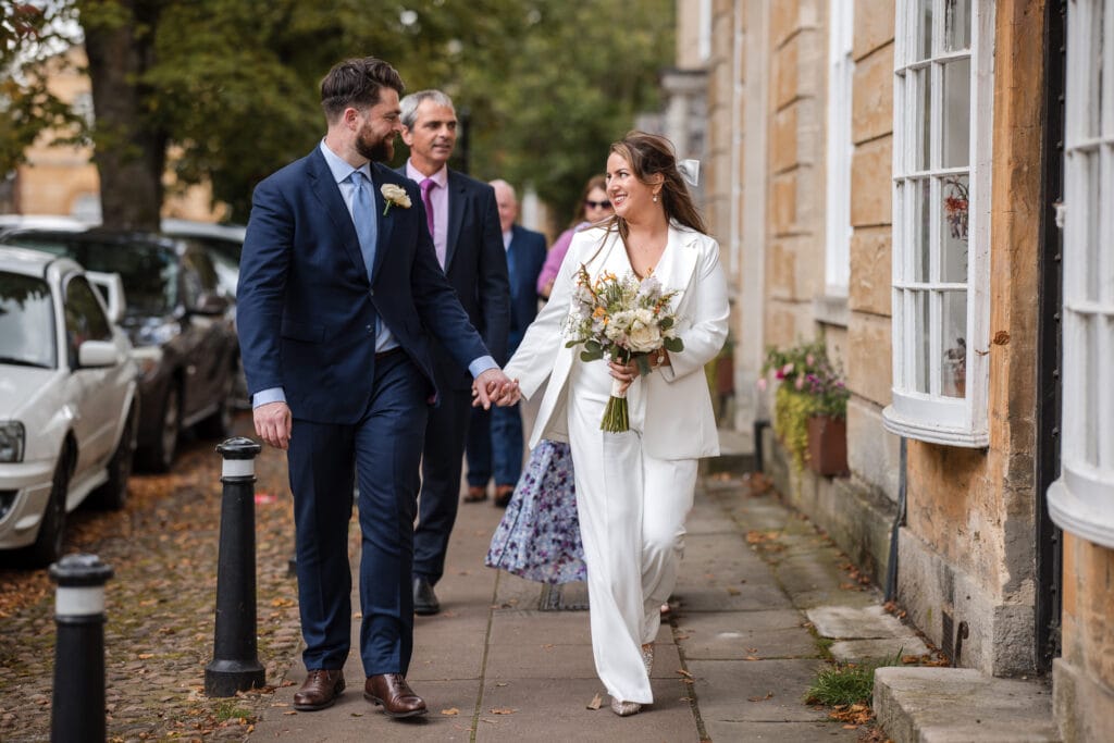 Bride and Groom walking in Woodstock town centre