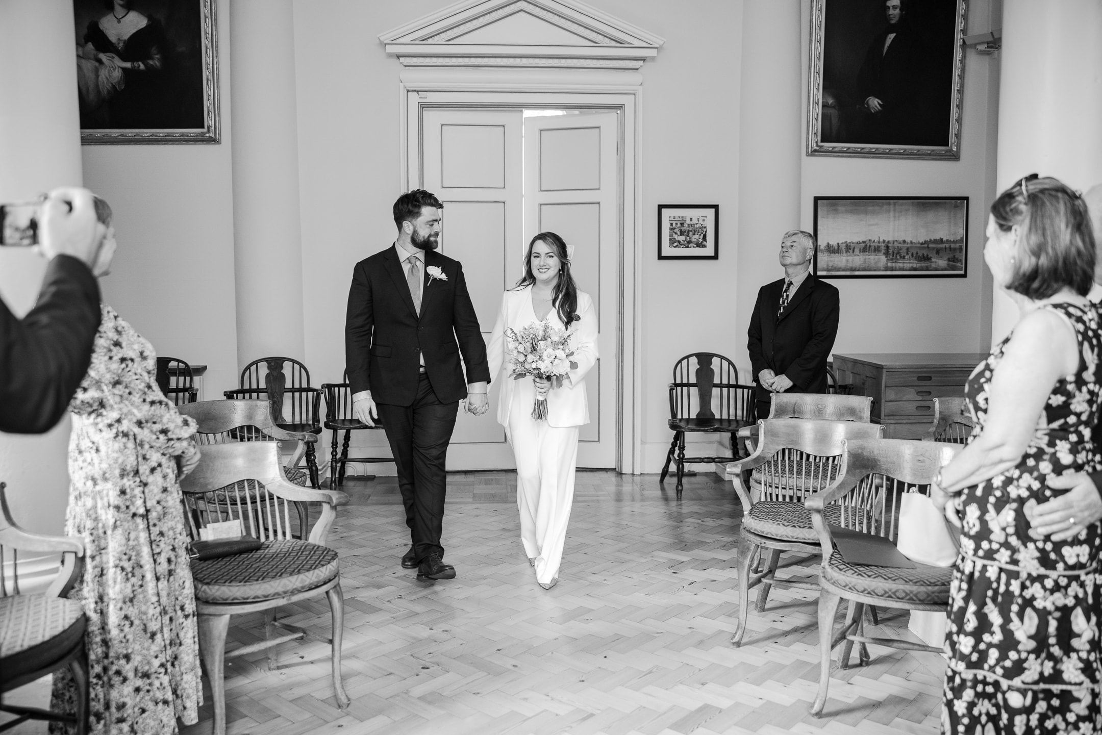 Bride and Groom walk into the Woodstock Townhall