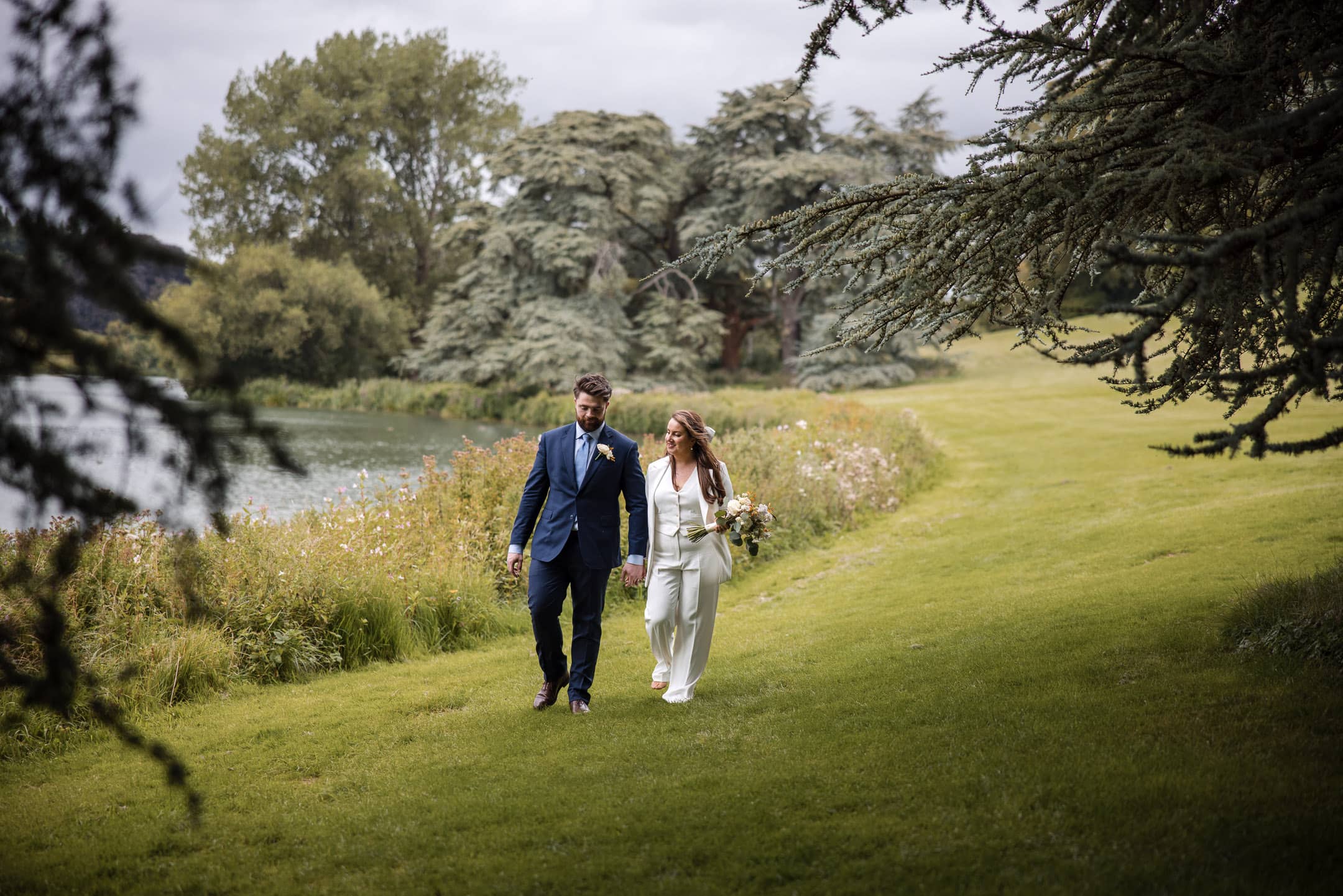 Bride and Groom walking around the lake at Blenheim Palace