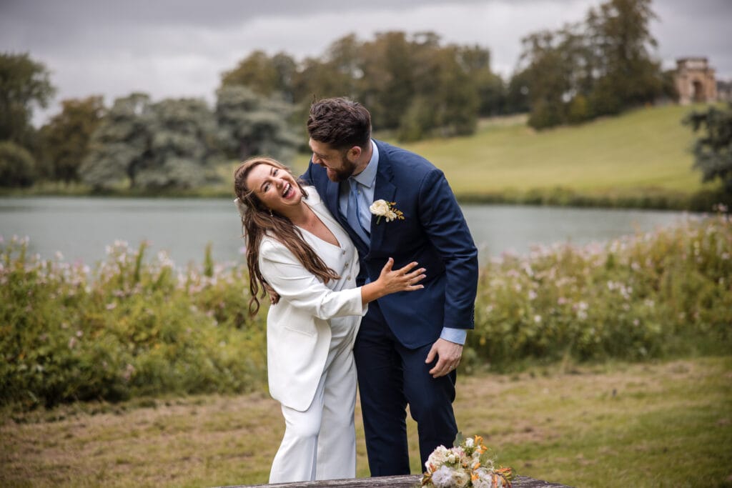 Bride and Groom laughing in the grounds of Blenheim Palace