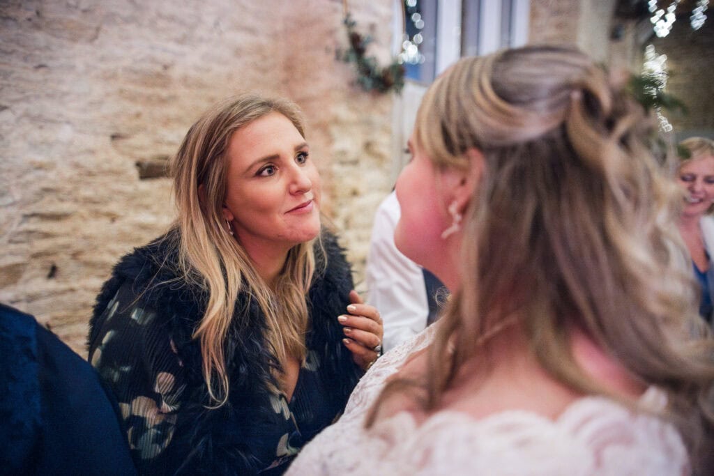Bride and friends looking into each others eyes