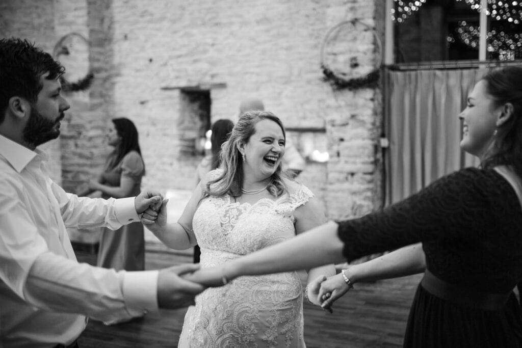 Bride dancing with Bridesmaid and Groom