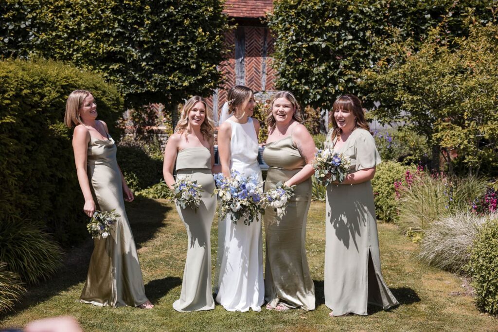 Bridesmaids and Bride getting ready for group photo