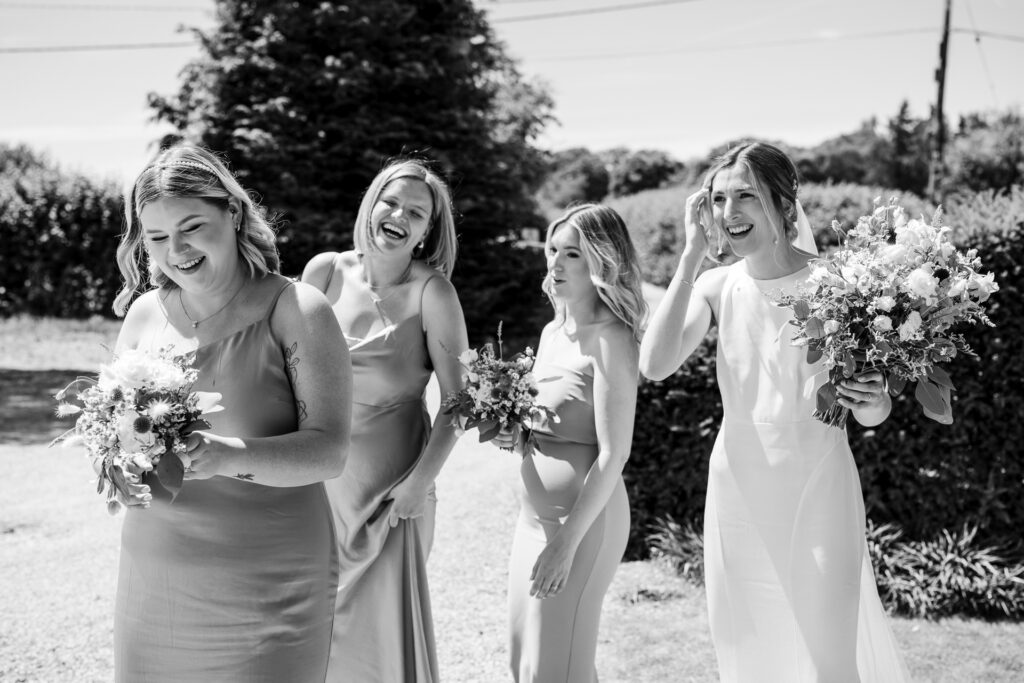 Bride and Bridesmaids enjoying the summer sun